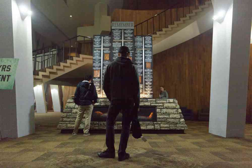 A photograph of a student looking at a monument