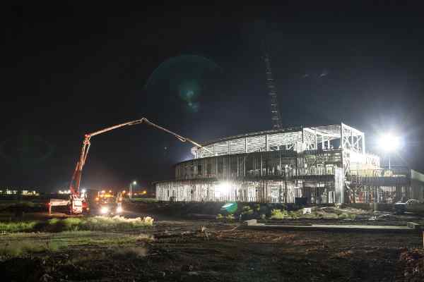 A photo in the early morning of a headquarters office being built